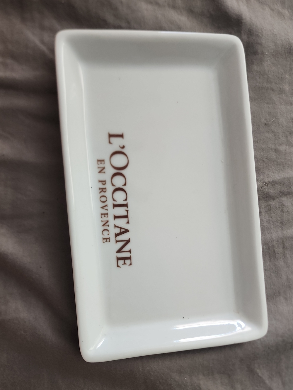 L'OCCITANE White Ceramic Logo Catchall Tray with Brown Lettering